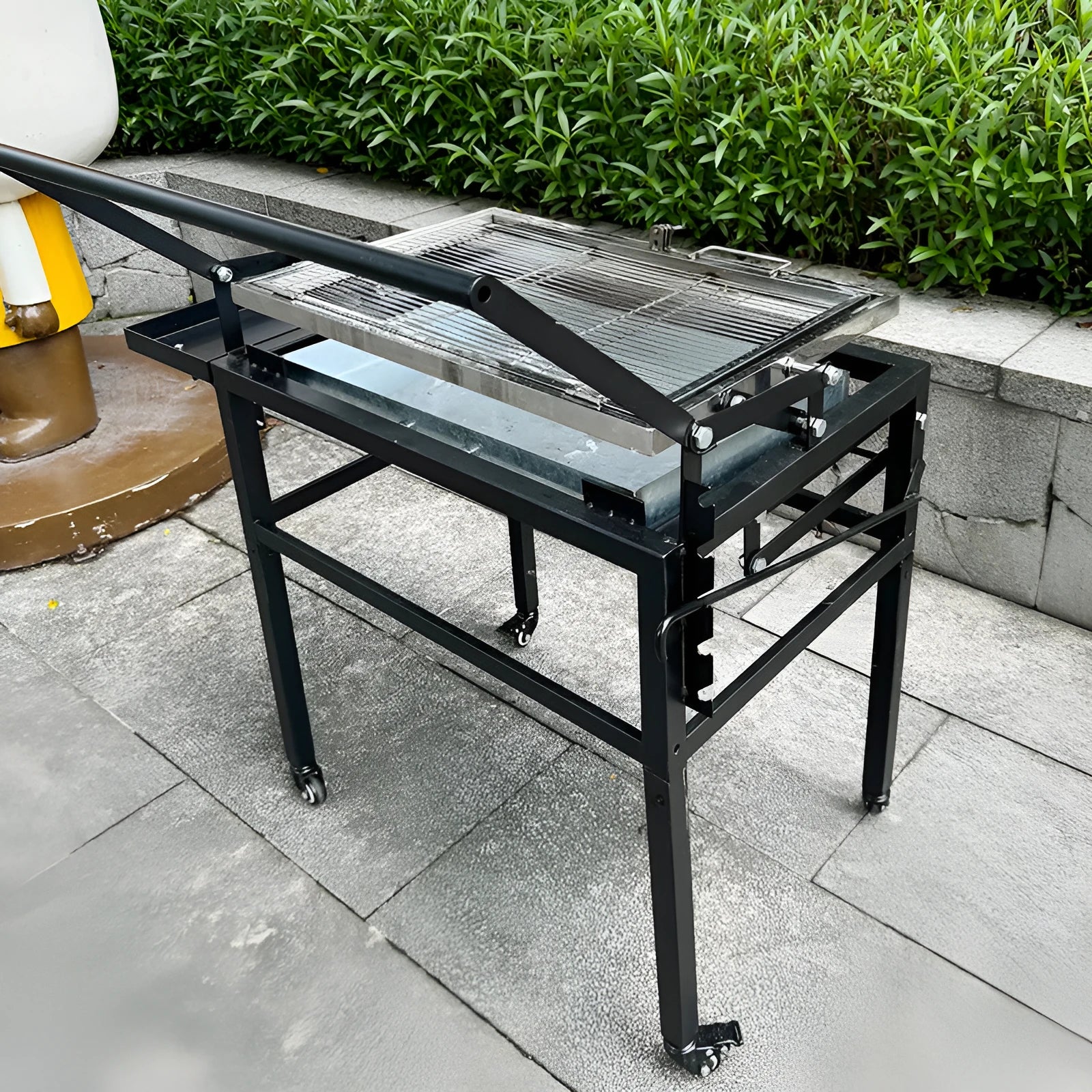 Large foldable charcoal BBQ stove with detachable components and grill accessory for outdoor cooking
