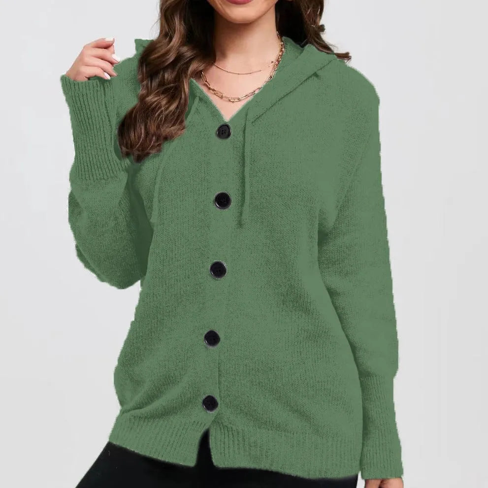 A woman wearing a loose-fit, hooded, solid-colour cotton cardigan sweater in a neutral tone.