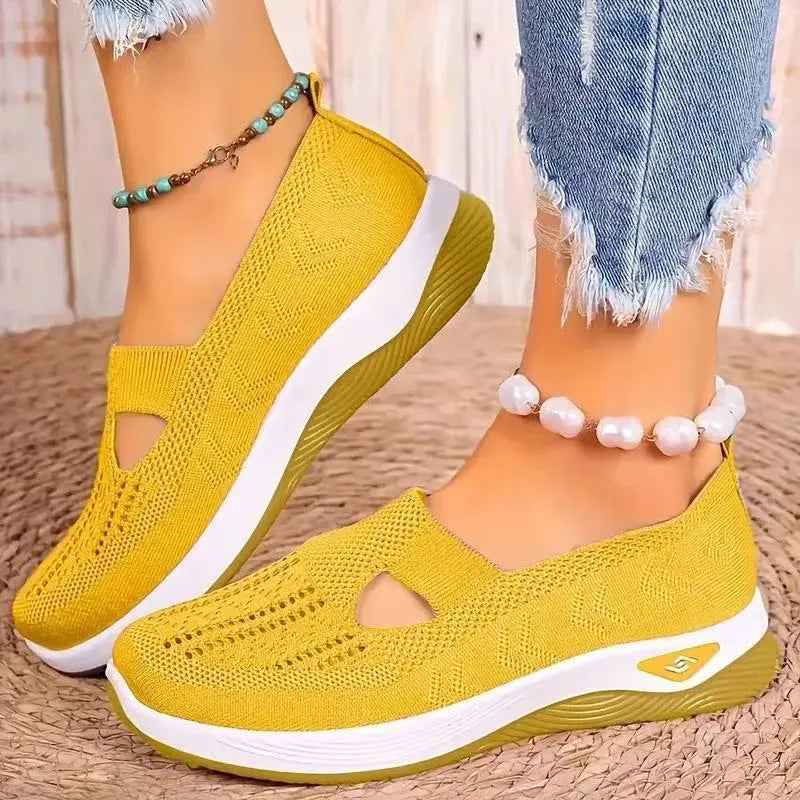 Women's solid colour mesh T-strap casual shoes with flat heel and round toe.