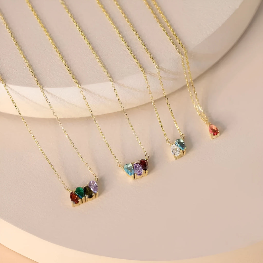 Zircon and diamond birthstone necklace on a titanium steel clavicle chain in rose gold, showing the April pendant style.