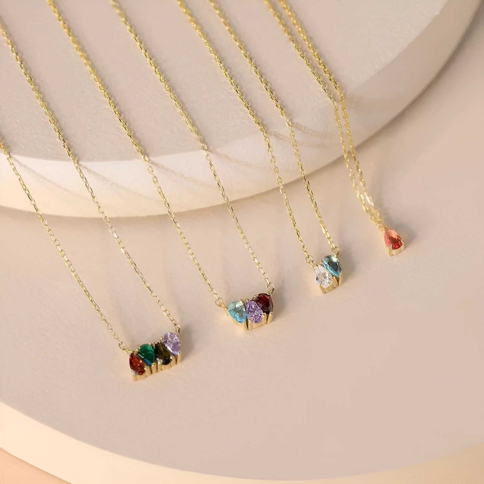 Zircon and diamond birthstone necklace on a titanium steel clavicle chain in rose gold, showing the April pendant style.