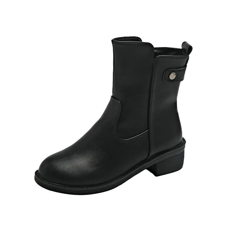 Black women's low heel ankle boots with side zip and round toe on a rubber sole.