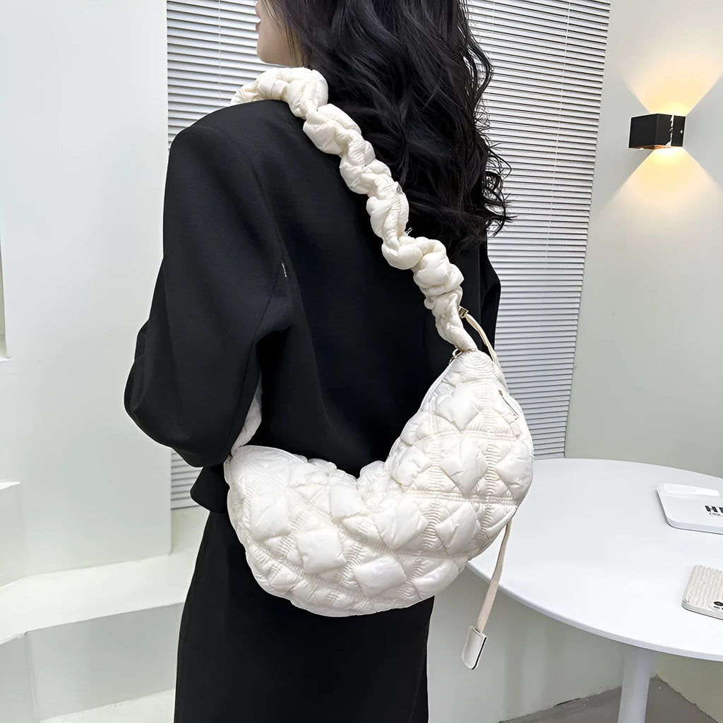 Beige nylon women's casual shoulder messenger bag with a long strap, shown from the side.
