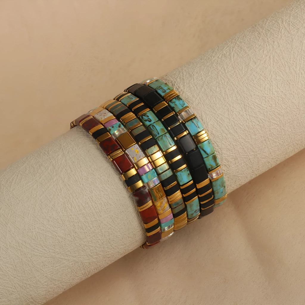 Adjustable glass beaded bracelet in geometric design with round beads available in five colours