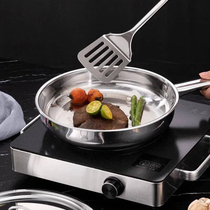 Stainless steel cookware set 15-piece with non-stick pan and glass lids on a countertop