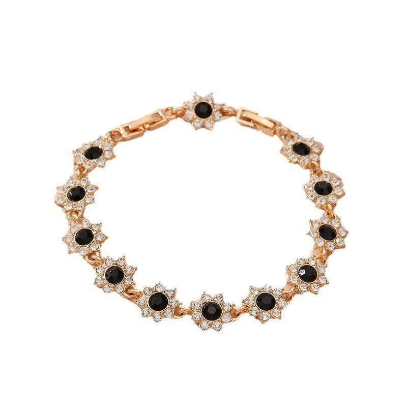Adjustable zinc alloy bracelet with electroplated flower-shaped links in gold and silver colour options with gemstone accents.