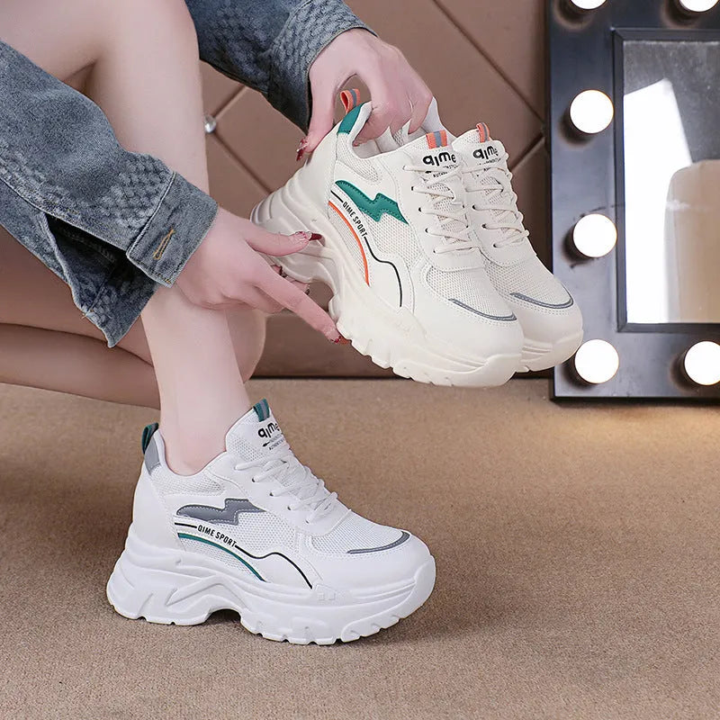 White women's dad shoes with cross straps, lace-up front, and a breathable mesh upper.