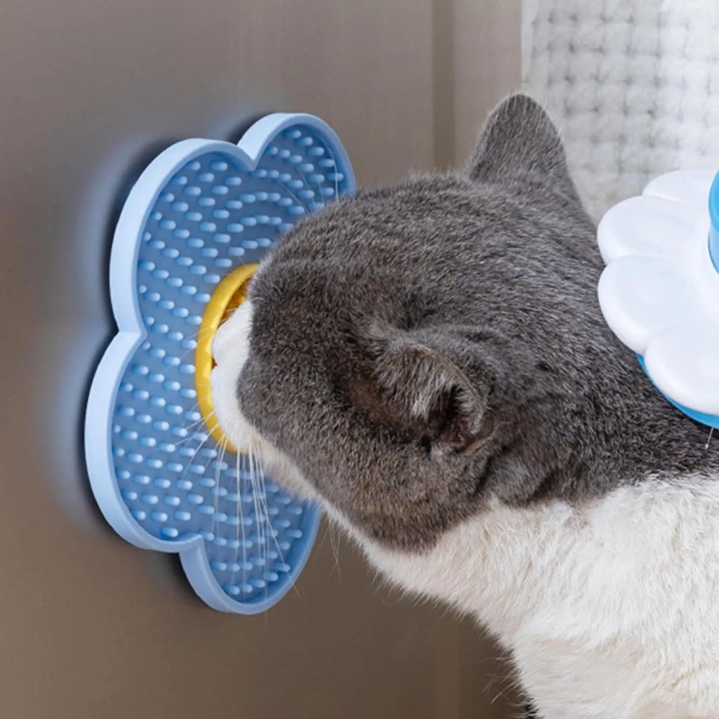 Flower-shaped silicone pet lick mat in assorted colours with suction cups on the base.