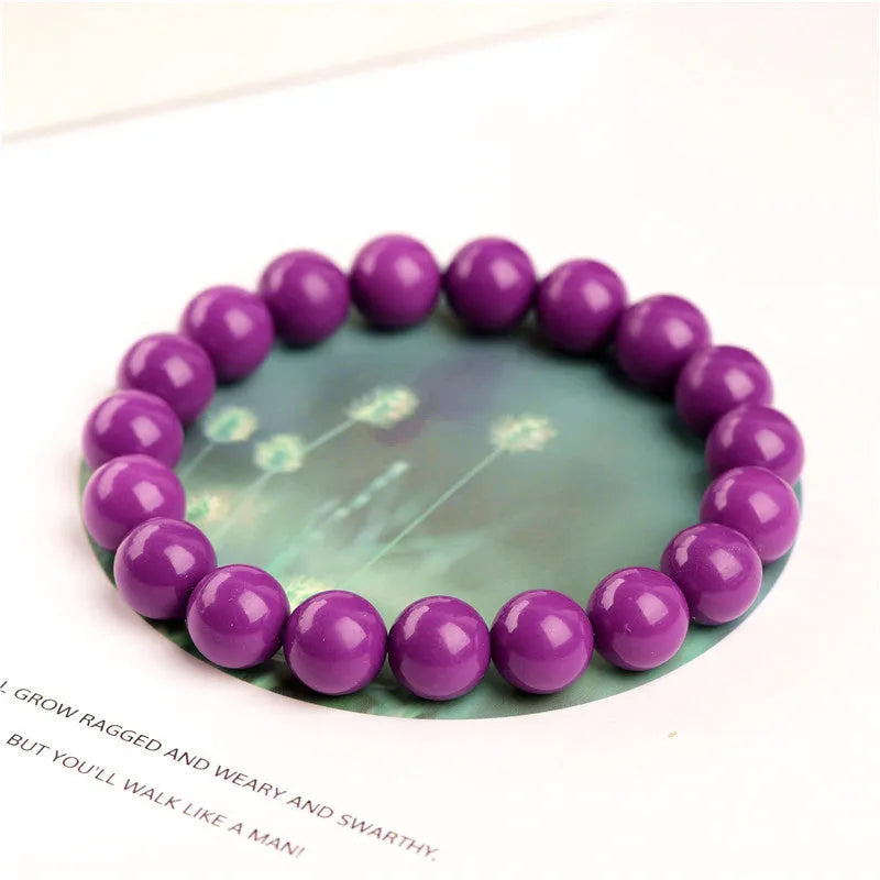 Polished purple mica crystal unisex bracelet in a single ring design on a white background.