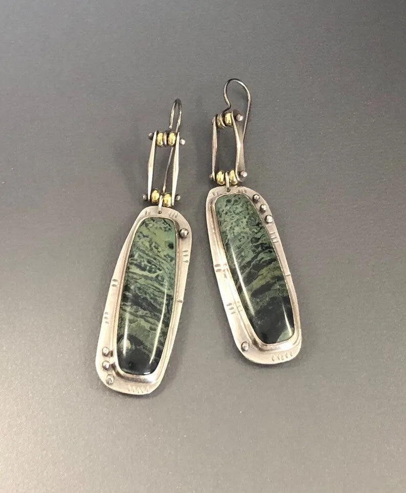 Two-colour marble pattern geometric alloy earrings showing geometric shape and two-tone surface design