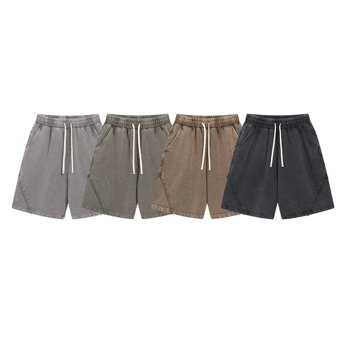 Man wearing retro-style batik washed grey-green cotton terry shorts with a loose fit.