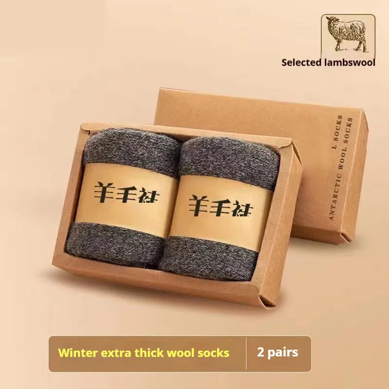 Two pairs of thick solid-colour winter wool socks with a merino wool midsole.