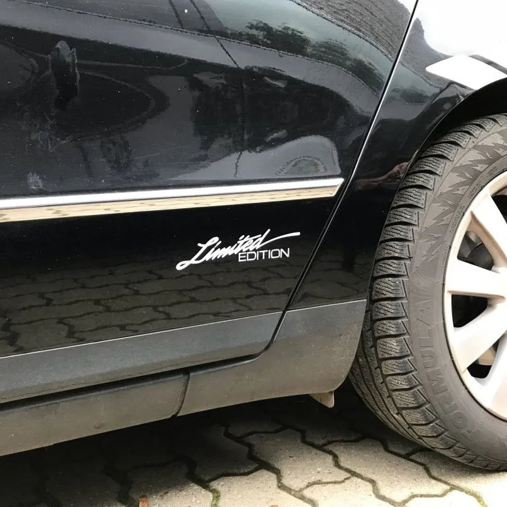 British style reflective plastic bumper sticker, 16cm long, shown in black, white and colourful options.