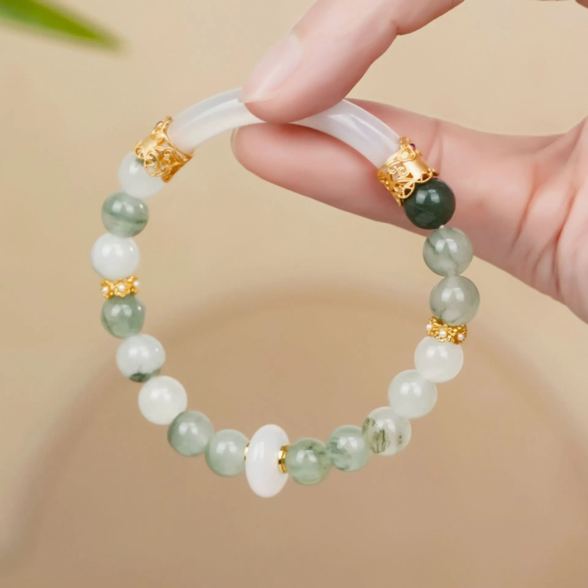 Emerald green Tian Shan Cui stone women's bracelet with floating floral motif and circular pattern