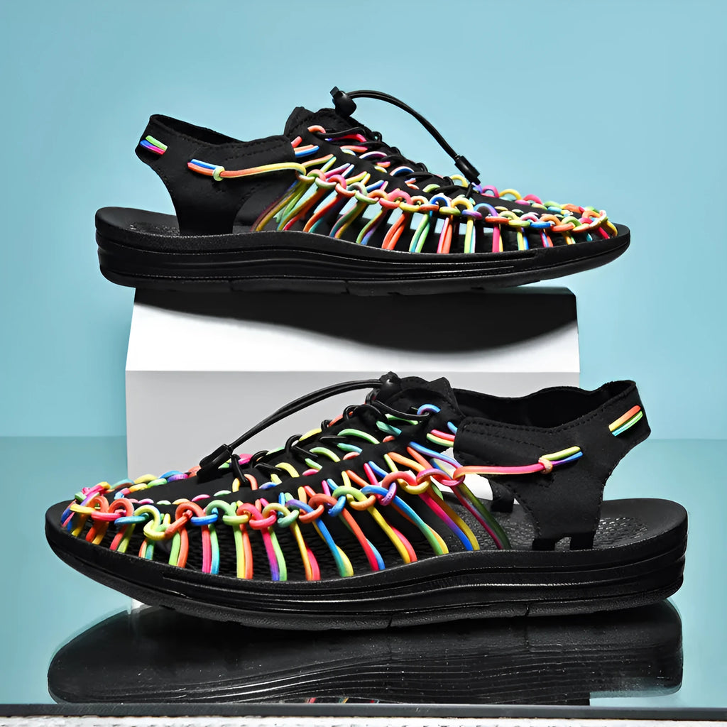 Woven Roman-style sandals with an elastic drawstring tie and non-slip rubber sole in rainbow colour.