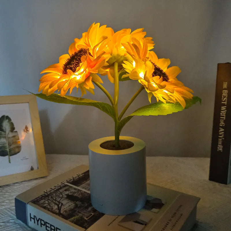 Rechargeable sunflower simulation LED night light table lamp with artificial flowers on a wooden table