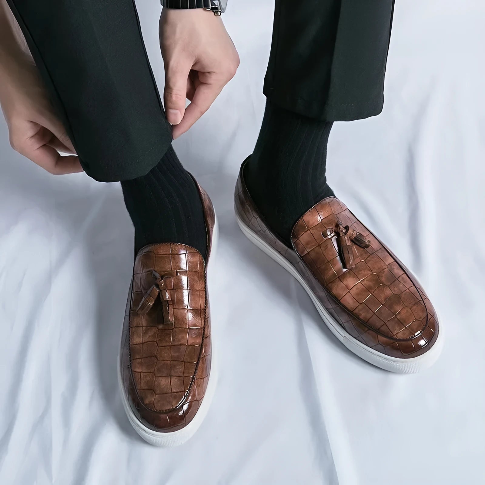 Men's black plus size business casual sneakers with a tassle detail on the artificial PU upper.