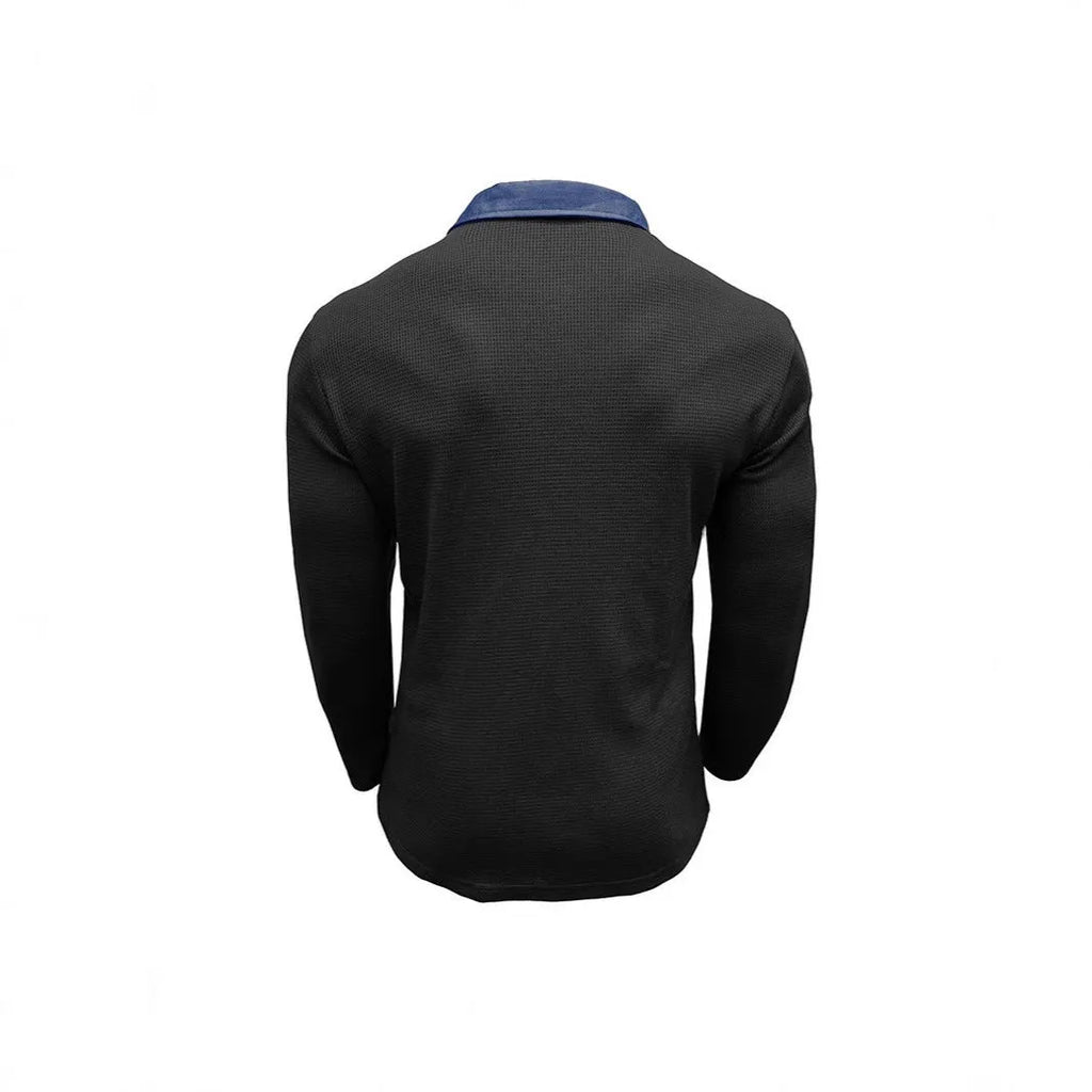 Man wearing a long-sleeved waffle-knit polo shirt in an asymmetric design, shown in a solid colour.