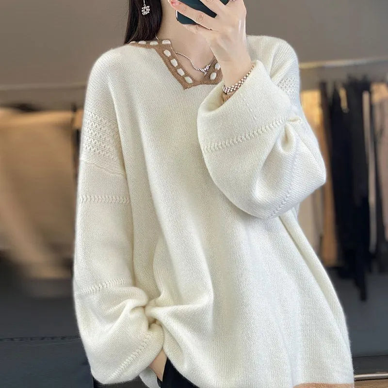 Women's camel coloured V-neck long sleeve viscose sweater laid flat.