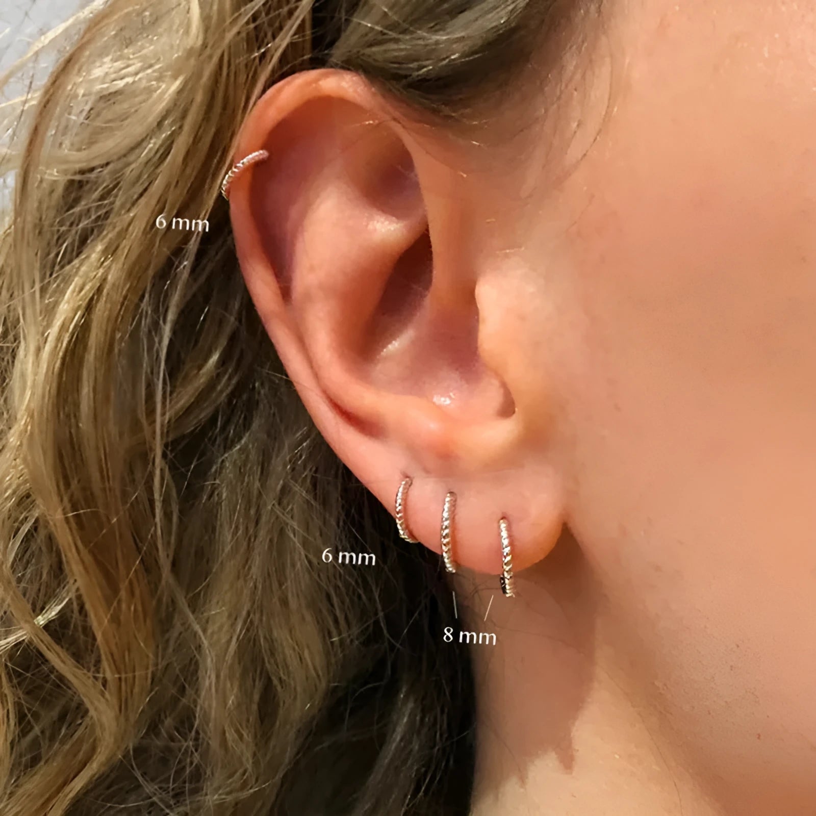 Twisted sterling silver round ring earrings in golden and white gold finishes