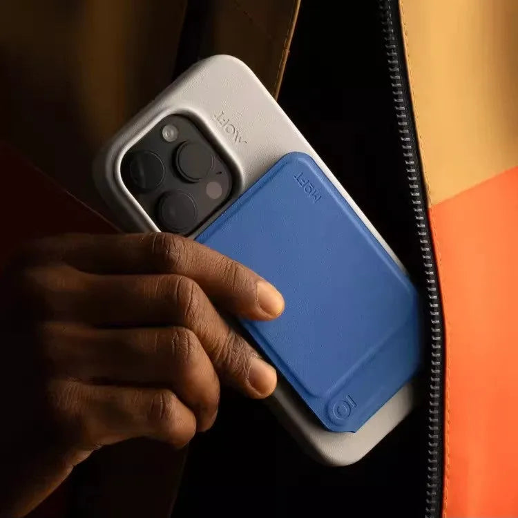 Magnetic mobile phone holder case in MOVAS plain leather showing four colour options: black, blue, green and grey