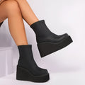 Plus size women's black wedge heel boot with a round toe and waterproof platform sole.