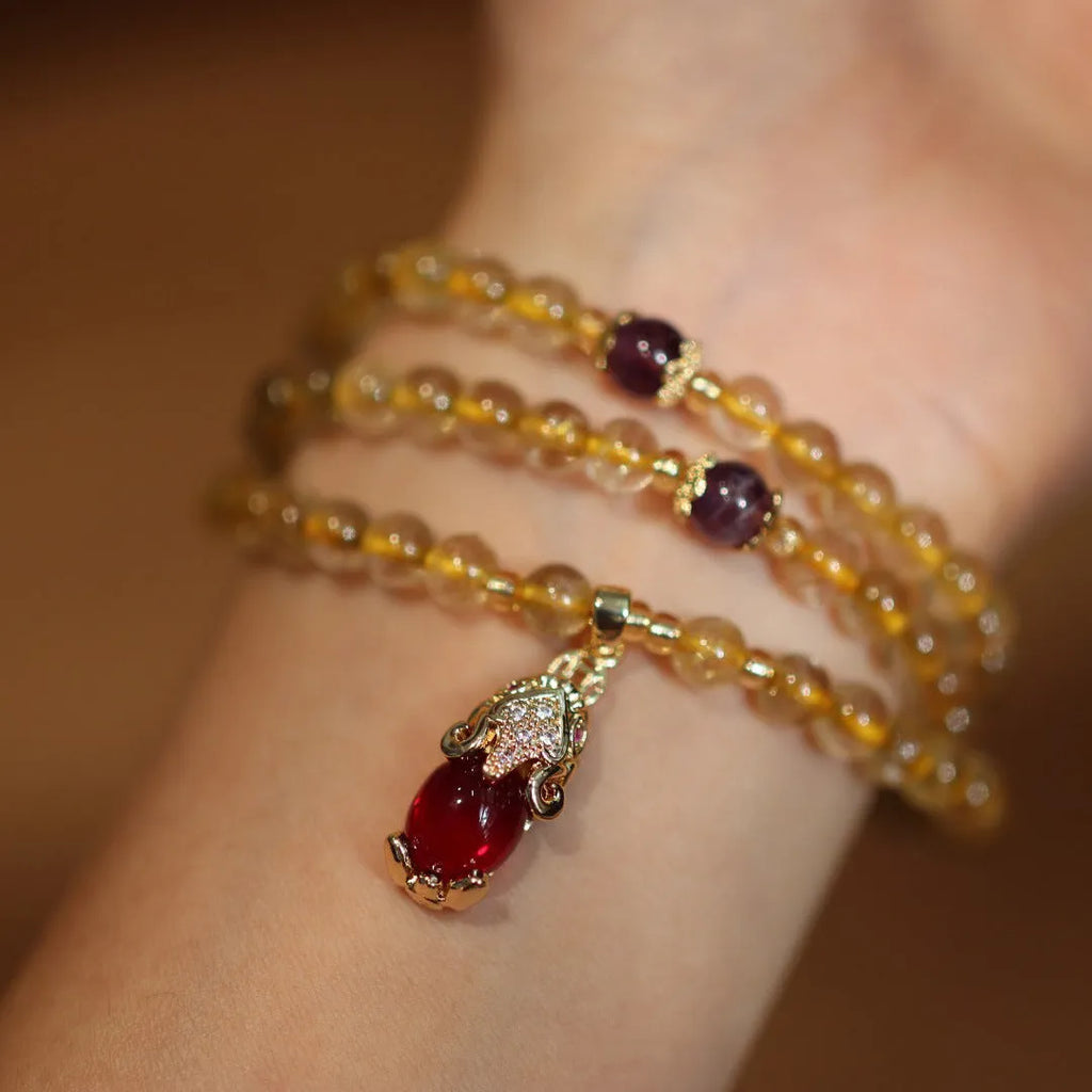 Brazil gold rutilated quartz bracelet with three golden circles and ruby quartz hanging chopsticks