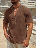 Men's solid colour stand collar short-sleeved casual shirt on a hanger