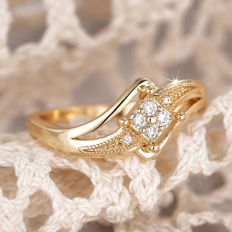 Women's geometric copper ring with micro inlaid zircon details in yellow gold colour.