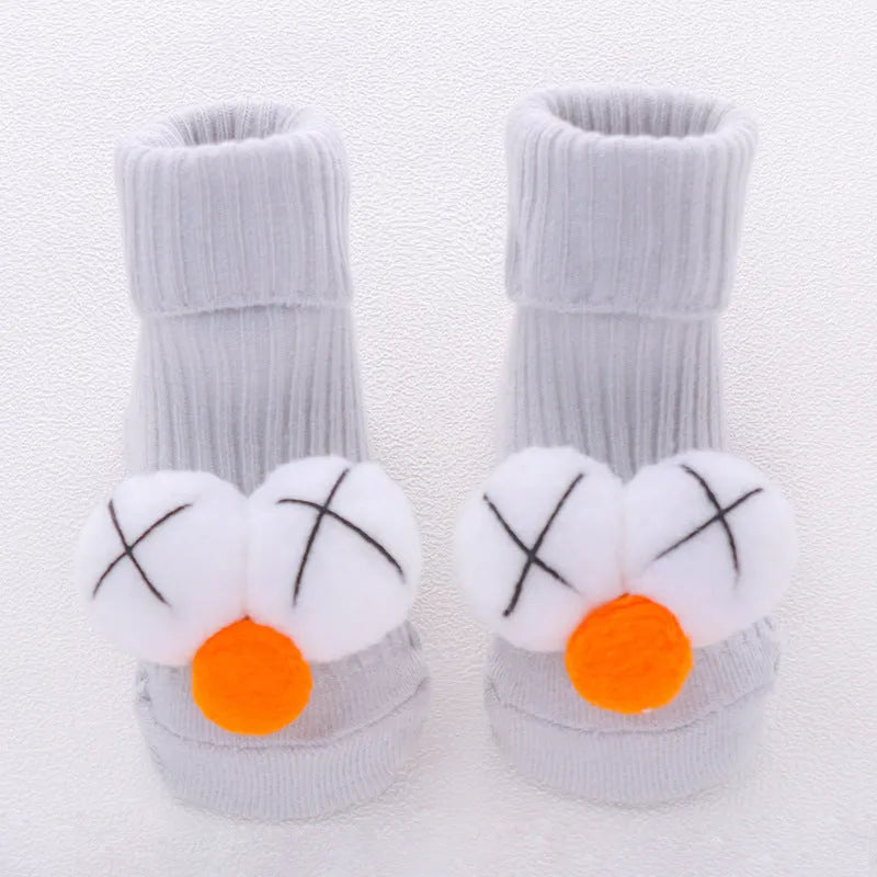Cotton baby floor socks in blue bow pattern for infants 0-3 months.