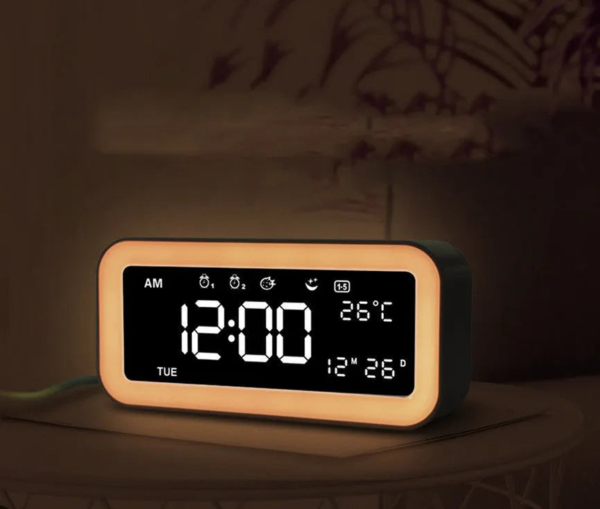 Blue rectangular LED atmosphere light alarm clock with digital display on bedside table