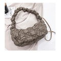 Beige nylon women's casual shoulder messenger bag with a long strap, shown from the side.