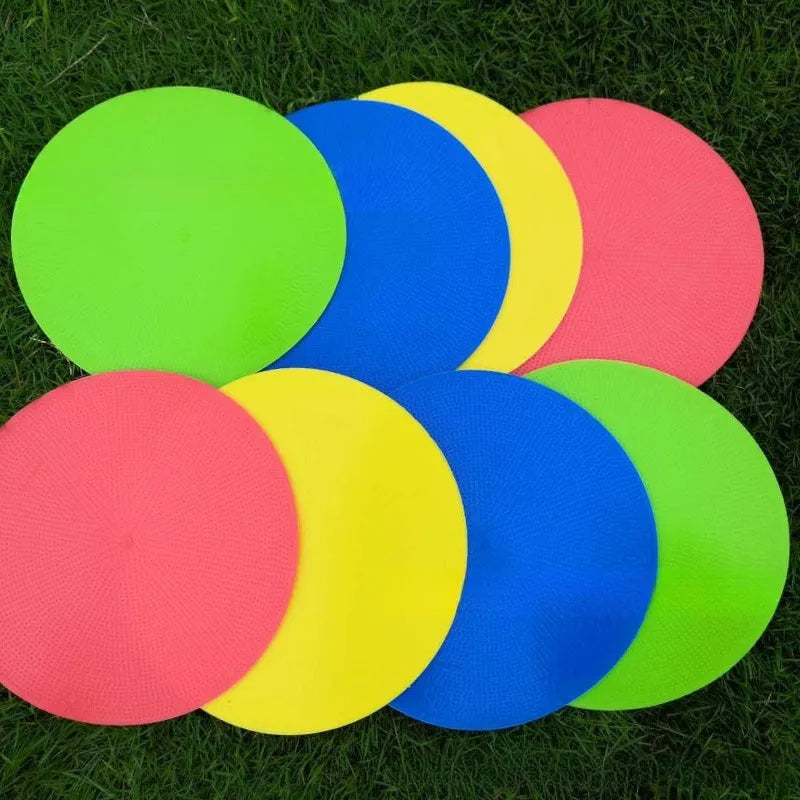 Soft yellow TPE football training disc on grass, showing 23cm diameter flat marker.