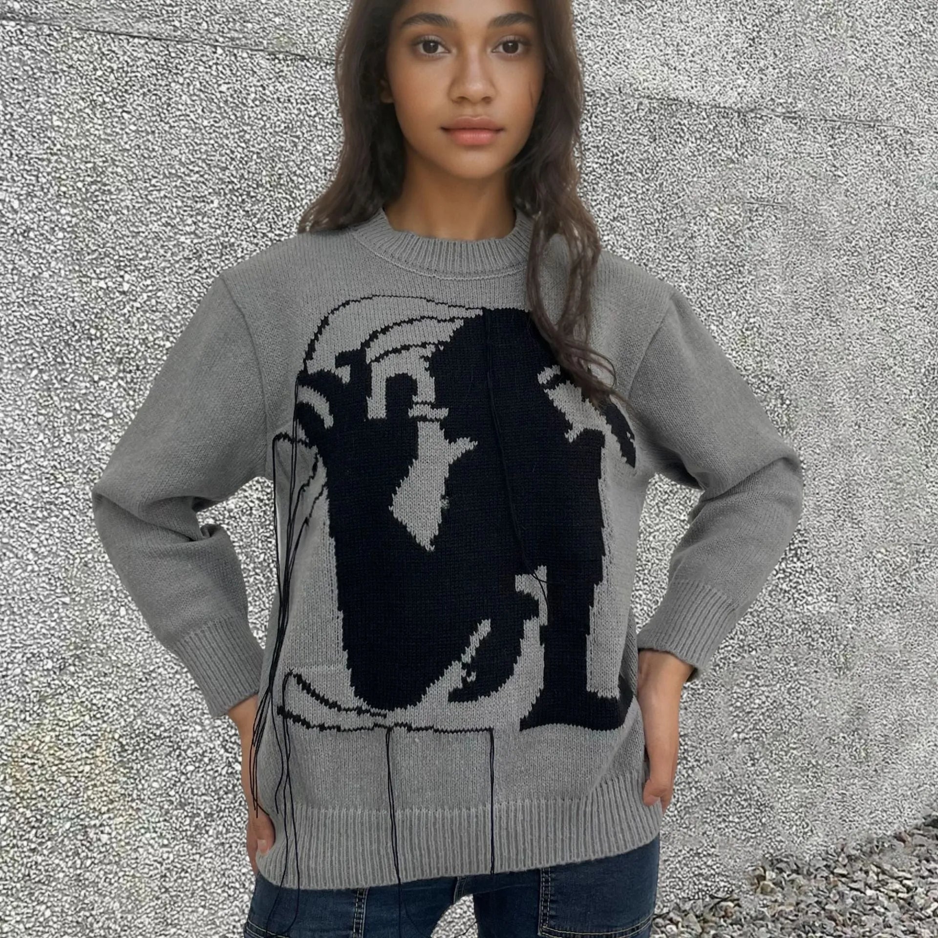 Women's loose grey alpaca wool sweater with tassel design and abstract pattern