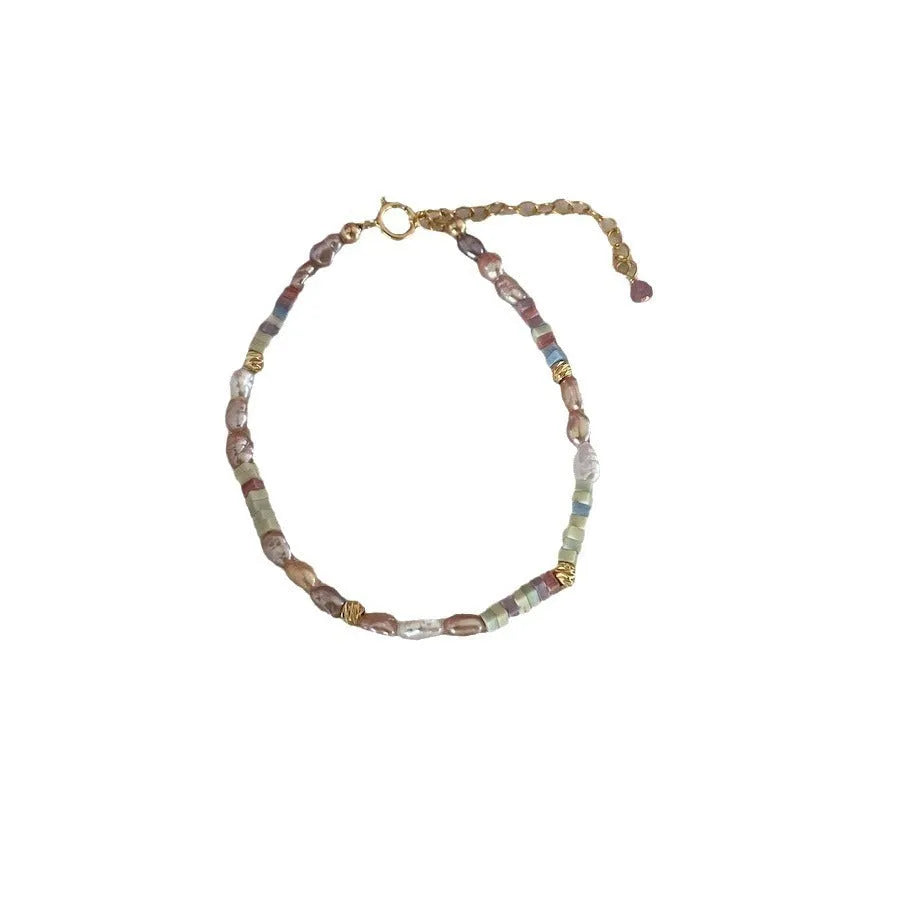 Handmade women's pearl jewellery set with purple natural pearls and 14K gold gilding