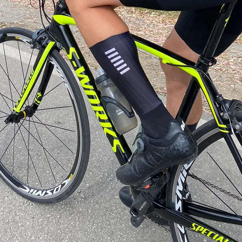 A pair of athletic socks for cycling and running in a chemical fibre blend, shown in one of six available colours.