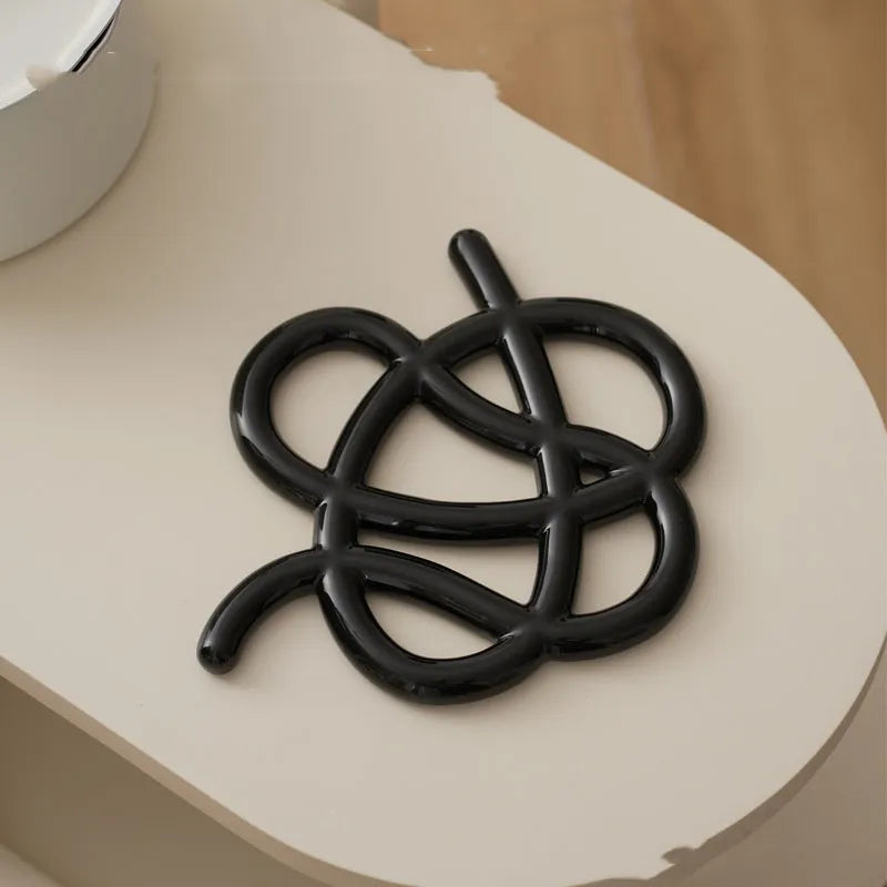 Ceramic heat proof mat in irregular shape for table protection in solid colours