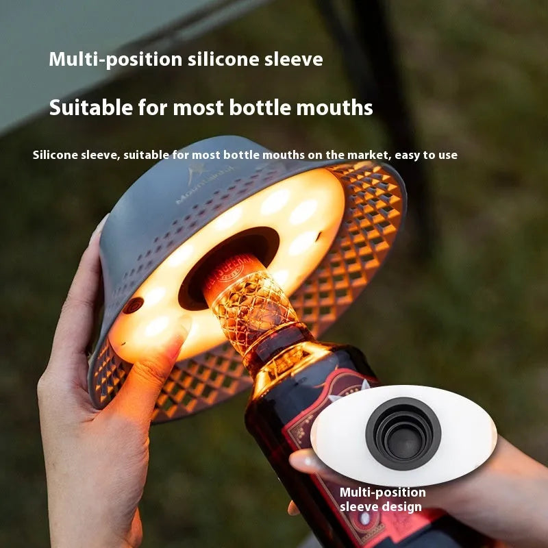 Wine bottle shaped camping lantern in beige or grey colour with USB-C charging port