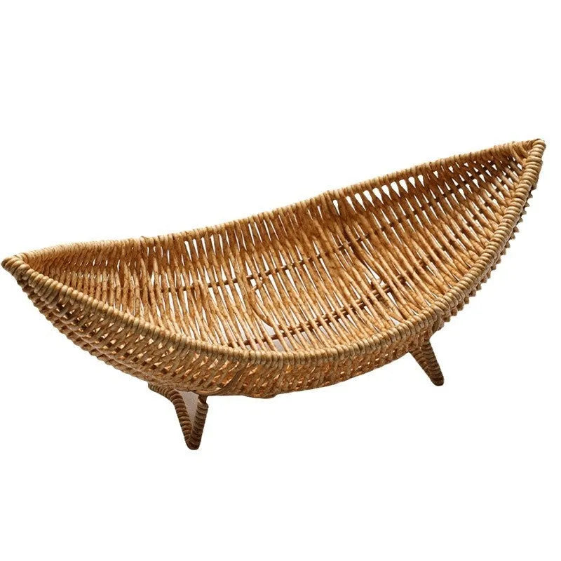 Plastic knitted basket fruit plate with dim sum snacks and melon seeds on a desktop