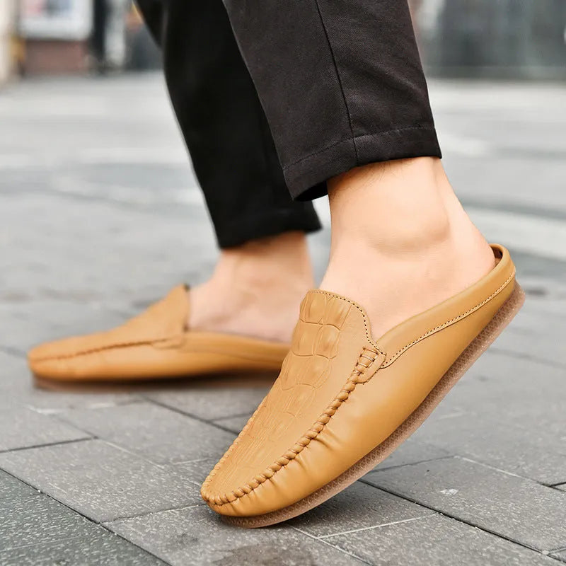 Men's black breathable semi-slippers with a rubber sole and artificial PU upper on a plain background.