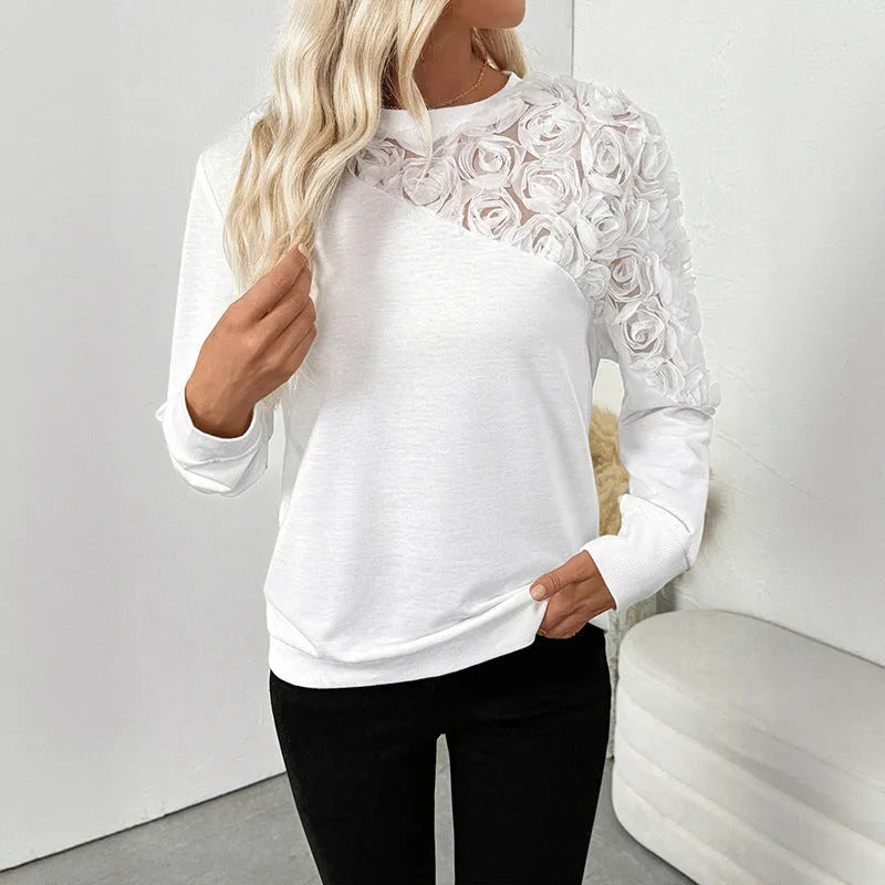 White long sleeve pullover top with floral pattern in loose fit style