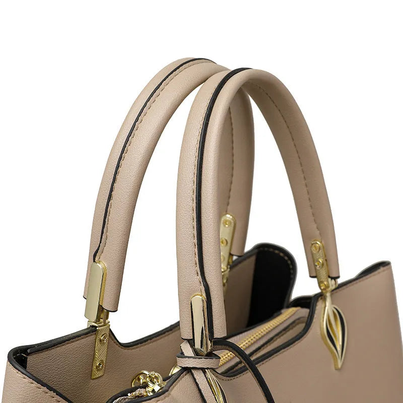Black women's multi-layer shoulder messenger bag made from PU leather with sewing thread detail.