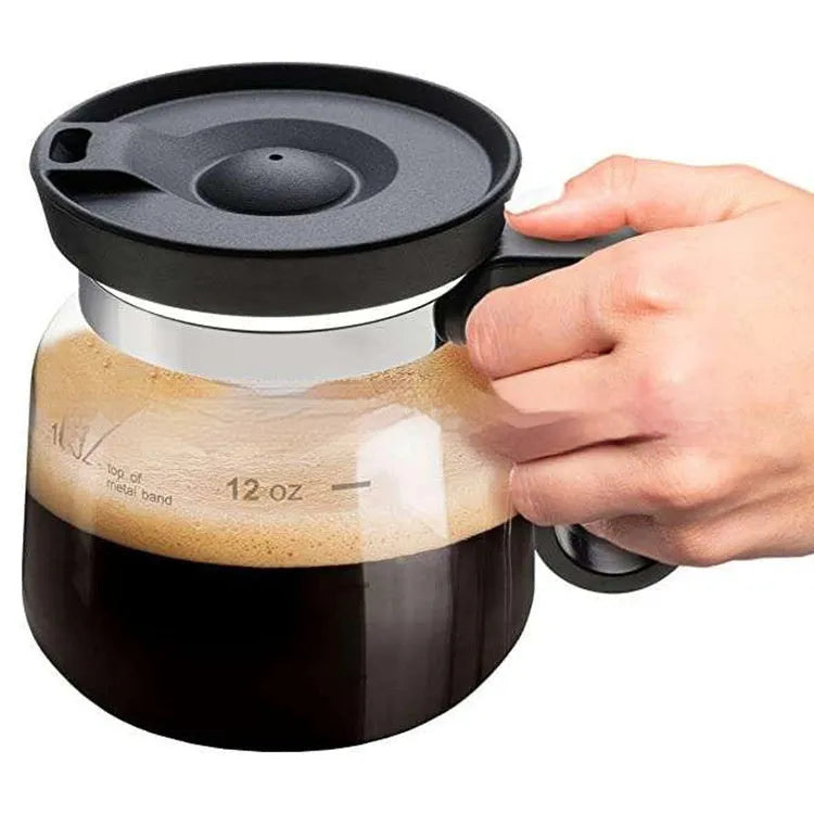 Transparent borosilicate glass coffee maker with silicone protective cover showing brewing capacity