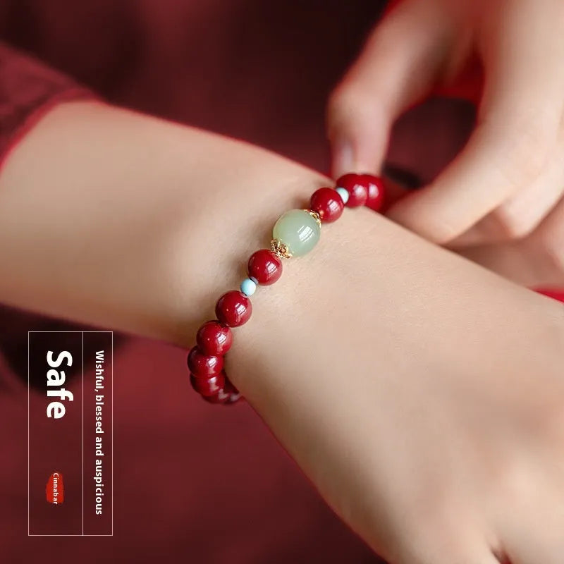 Purple Gold Sand cinnabar and Hetian jade bead bracelet with geometric ellipse shapes on a wrist.