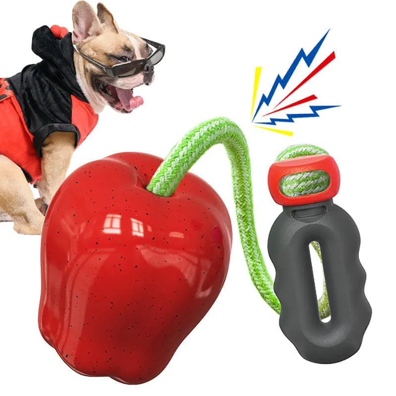 Green Apple-shaped dog toy with dropping ball mechanism for food reward chewing activity
