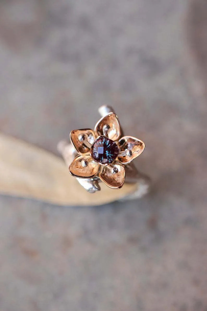 Women's two-tone floral geometric alloy ring in silver colour on display