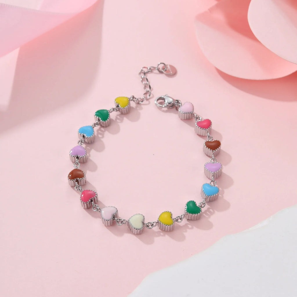 Gold plated women's bracelet with love heart pendant on titanium steel chain