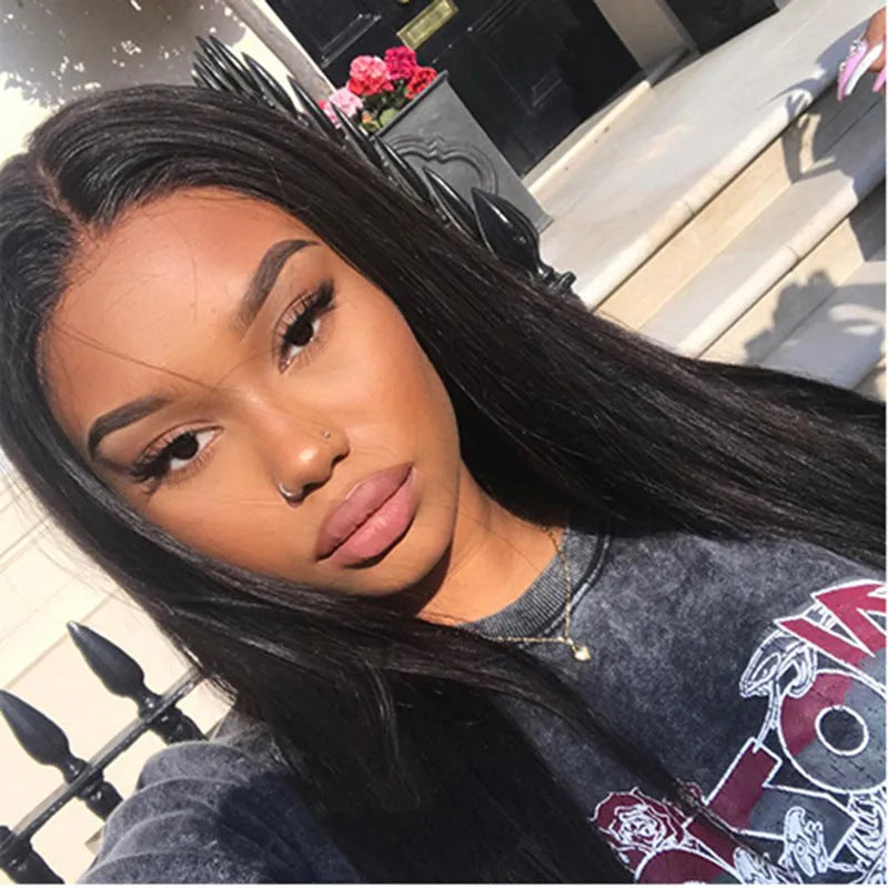 Long black straight hair wig with centre-parted bangs on a model