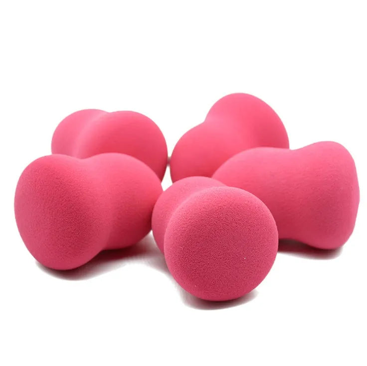 Pink makeup foundation sponge with soft texture measuring 4cm by 4cm by 5.6cm