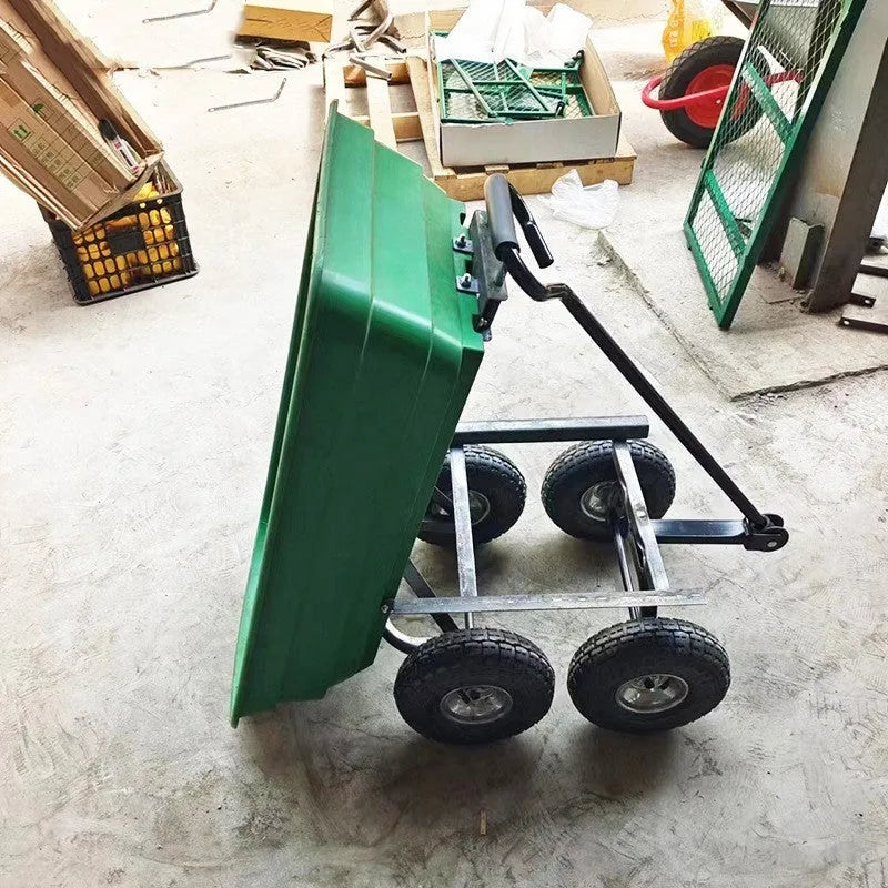 Green four-wheel plastic dump truck with steel reinforcement and dump mechanism for agricultural material transport
